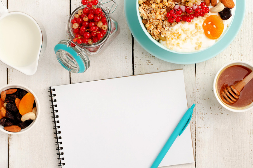 Healthy breakfast and notebook