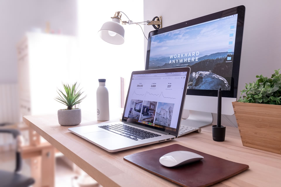 Laptop and display on desk